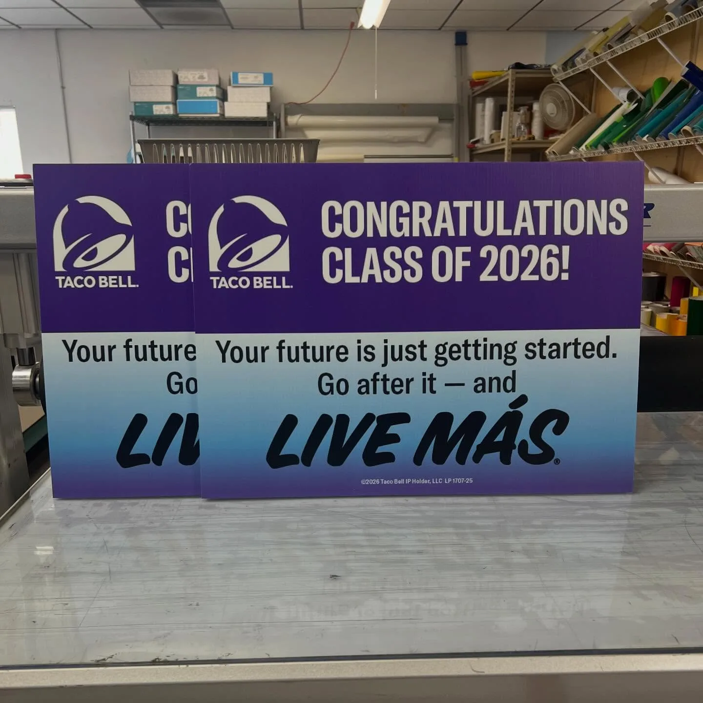 Graduation signs coming off the work table
